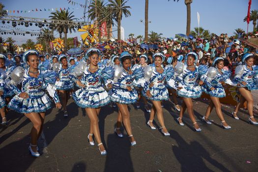 Caporales dancers in traditional Andean costume performing at the annual Carnaval Andino con la Fuerza del Sol in Arica, Chile.
