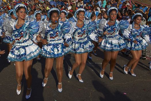 Caporales dancers in traditional Andean costume performing at the annual Carnaval Andino con la Fuerza del Sol in Arica, Chile.