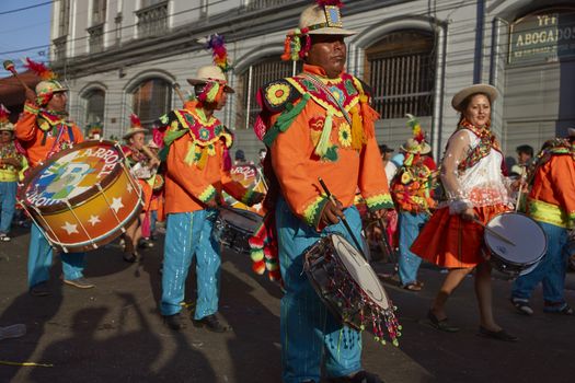 Music and dance group in traditional Andean costume performing at the annual Carnaval Andino con la Fuerza del Sol in Arica, Chile.
