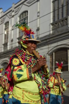 Band in traditional Andean costume performing at the annual Carnaval Andino con la Fuerza del Sol in Arica, Chile.