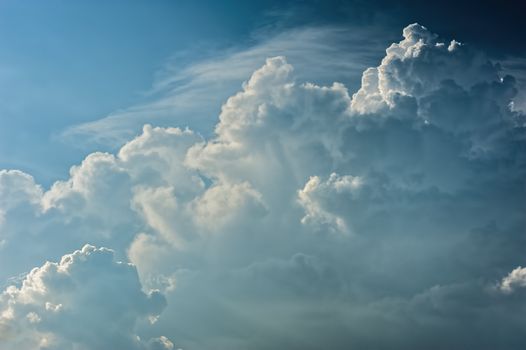 Large fluffy cloud relief details on blue sky