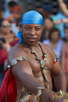 Male dancer of African descent (Afrodescendiente performing at the annual Carnaval Andino con la Fuerza del Sol in Arica, Chile.
