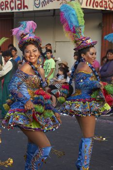 Morenada dancers in traditional Andean costume performing at the annual Carnaval Andino con la Fuerza del Sol in Arica, Chile.