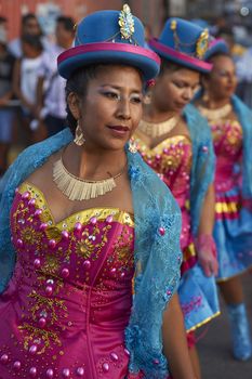 Morenada dancers in traditional Andean costume performing at the annual Carnaval Andino con la Fuerza del Sol in Arica, Chile.