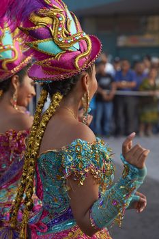 Morenada dancers in traditional Andean costume performing at the annual Carnaval Andino con la Fuerza del Sol in Arica, Chile.