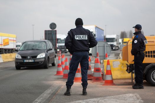 FRANCE, Neuville-en-Ferrain: French police officers check vehicles at the French-Belgian border, near Neuville-en-Ferrain, northern France, on March 22, 2016 , as security measures have been reinforced after a series of apparently coordinated explosions ripped through Brussels airport and a metro train on Tuesday, killing at least 26 people in the latest attacks to target Europe.