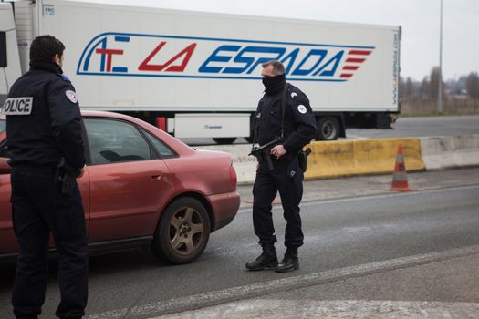 FRANCE, Neuville-en-Ferrain: French police officers check vehicles at the French-Belgian border, near Neuville-en-Ferrain, northern France, on March 22, 2016 , as security measures have been reinforced after a series of apparently coordinated explosions ripped through Brussels airport and a metro train on Tuesday, killing at least 26 people in the latest attacks to target Europe.