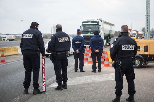 FRANCE, Neuville-en-Ferrain: Belgian and French police officers check vehicles at the French-Belgian border, near Neuville-en-Ferrain, northern France, on March 22, 2016 , as security measures have been reinforced after a series of apparently coordinated explosions ripped through Brussels airport and a metro train on Tuesday, killing at least 26 people in the latest attacks to target Europe.