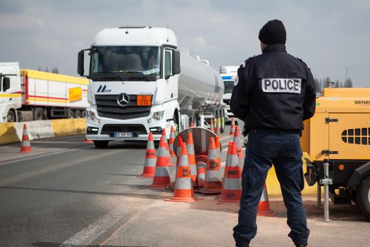 FRANCE, Neuville-en-Ferrain: A French police officer checks vehicles at the French-Belgian border, near Neuville-en-Ferrain, northern France, on March 22, 2016 , as security measures have been reinforced after a series of apparently coordinated explosions ripped through Brussels airport and a metro train on Tuesday, killing at least 26 people in the latest attacks to target Europe.