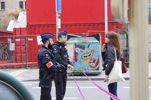 BELGIUM, Brussels: Several streets are closed off in Brussels, Belgium as police speak to a civilian near Maelbeek metro station, following the deadly attacks both here and at Zaventem airport on March 22, 2016. The attacks, at least one of which was carried out by a suicide bomber, left at least 30 dead, and scores more injured.