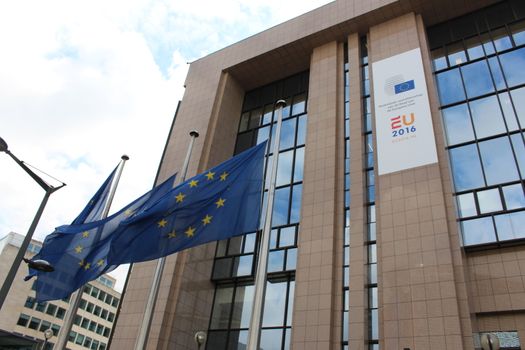 BELGIUM, Brussels: Flags outside the Council of the European Union in Brussels, Belgium have been lowered following the deadly attacks at Maelbeek metro station and Zaventem airport on March 22, 2016. The attacks, at least one of which was carried out by a suicide bomber, left at least 30 dead, and scores more injured.