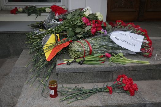 RUSSIA, Moscow: A makeshift memorial has taken shape at the Belgian Embassy in Moscow, Russia following the terror attacks that left at least 30 dead and hundreds injured in Brussels, Belgium on March 22, 2016. The Islamic State terror group has taken responsibility for the attacks, which brought death and destruction on Zaventem airport and Maelbeek metro station.