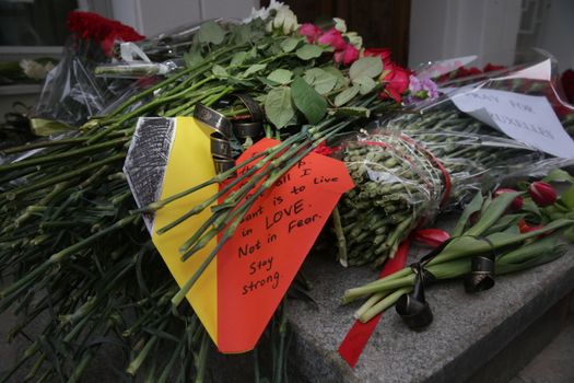 RUSSIA, Moscow: A makeshift memorial has taken shape at the Belgian Embassy in Moscow, Russia following the terror attacks that left at least 30 dead and hundreds injured in Brussels, Belgium on March 22, 2016. The Islamic State terror group has taken responsibility for the attacks, which brought death and destruction on Zaventem airport and Maelbeek metro station.