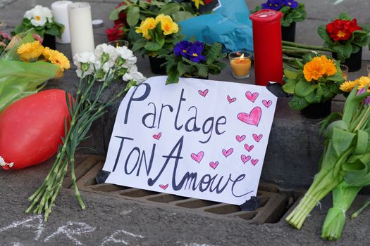 BELGIUM, Brussels: A note reading 'Share your love' is seen as hundreds pay tribute to the victims of the attacks that hit the Belgian capital on March 22, 2016.