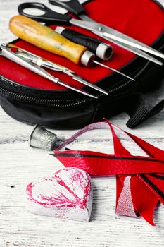 Sewing tool for needlework and leather scraps