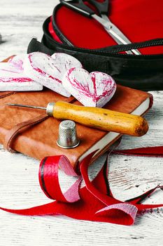 Sewing tool for needlework and leather scraps
