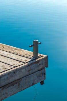 A pieceful wooden pier and blue sea