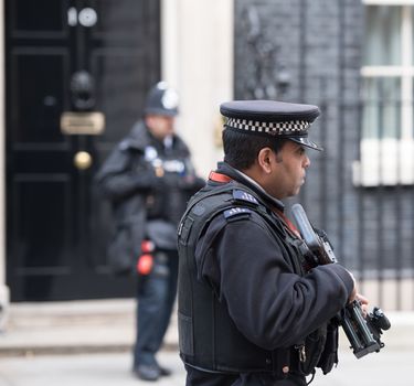 UK, London: Police stand guard on Downing Street during the emergency COBRA meeting on March 22, 2016, in London.The meeting at 10 Downing Street, came after a series of bombings left at least 30 people dead in the Belgian capital of Brussels earlier in the day.