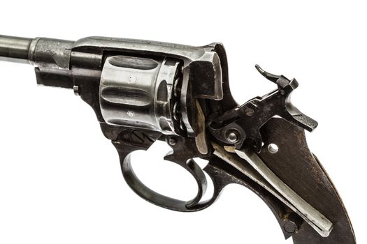 Disassembled revolver, pistol mechanism with the hammer cocked, isolated on white background