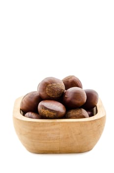 Sweet chestnut in wooden bowl on white background