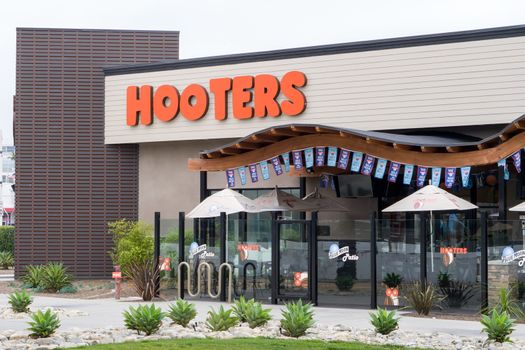 LONG BEACH, CA/USA - MARCH 19, 2016: Hooters exterior and logo. Hooters is a casual dining restaurant chain in the United States.