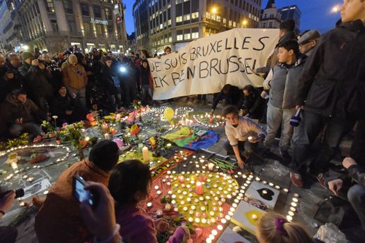 BELGIUM, Brussels: A banner which reads I am Brussels is seen as thousands gather around a makeshift memorial to pay tribute and mourn the victims of the bomb attacks, at the Place de la Bourse, in Brussels, Belgium, March 22, 2016.