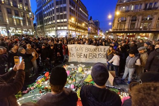 BELGIUM, Brussels: A banner which reads I am Brussels is seen as thousands gather around a makeshift memorial to pay tribute and mourn the victims of the bomb attacks, at the Place de la Bourse, in Brussels, Belgium, March 22, 2016.