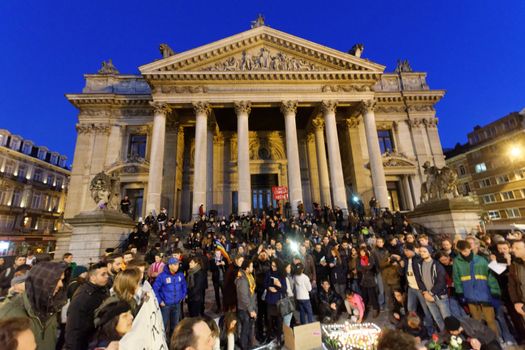BELGIUM, Brussels: Thousands gather around a makeshift memorial to pay tribute and mourn the victims of the bomb attacks, at the Place de la Bourse, in Brussels, Belgium, March 22, 2016.
