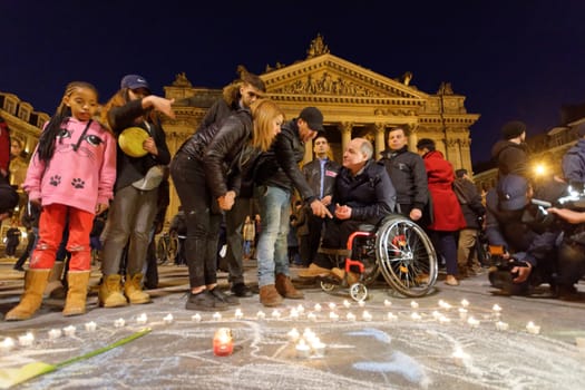 BELGIUM, Brussels: Thousands gather around a makeshift memorial to pay tribute and mourn the victims of the bomb attacks, at the Place de la Bourse, in Brussels, Belgium, March 22, 2016.