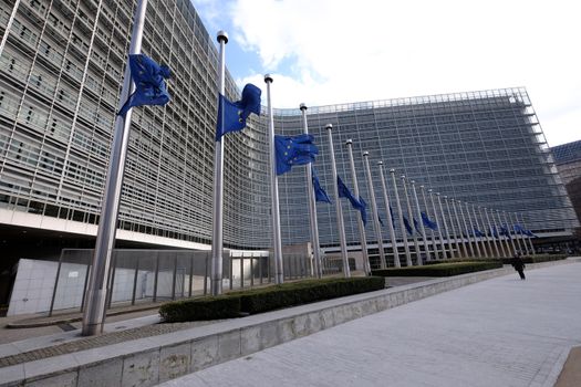 BELGIUM, Brussels: European Union flags fly at half-mast in front of  the EU Commission Headquarters in respect and remembrance of the victims of the terror attack that hit Brussels on March 22, 2016. At least 30 people are thought to have been killed after Zaventem airport and Maelbeek Metro station were targeted by explosions.