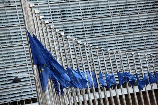 BELGIUM, Brussels: European Union flags fly at half-mast in front of  the EU Commission Headquarters in respect and remembrance of the victims of the terror attack that hit Brussels on March 22, 2016. At least 30 people are thought to have been killed after Zaventem airport and Maelbeek Metro station were targeted by explosions.