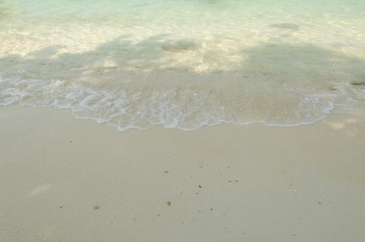 Beautiful sea summer or spring abstract background. Golden sand beach with blue ocean.