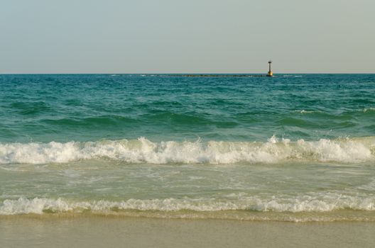 Beautiful sea summer or spring abstract background. Golden sand beach with blue ocean.