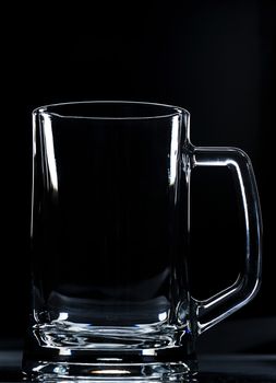 beer empty of glass on a black background