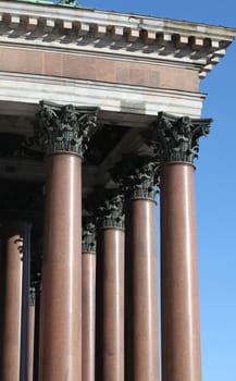 columns with portico on background blue sky