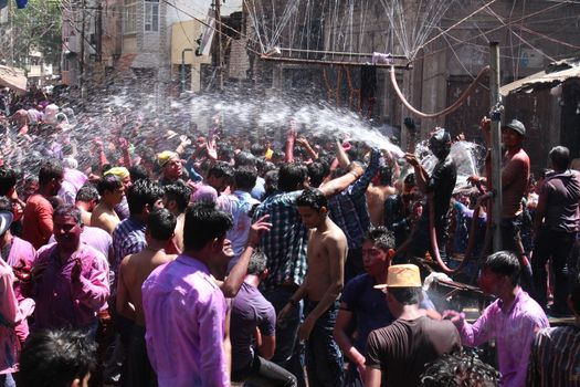 INDIA, Allahabad :  Indian people celebrate the Holi festival in Allahabad on March 23, 2015. Holi, the Hindu spring festival or 'Festival of Colours' is celebrated with coloured powder and water and marks the end of winter and the beginning of spring. 