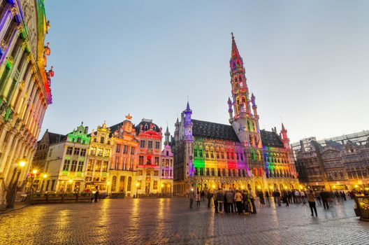 Brussels, Belgium - May 13, 2015: Tourists visiting famous Grand Place (Grote Markt) the central square of Brussels. The square is the most important tourist destination and most memorable landmark in Brussels.