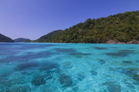 Tropical beach against blue sky at Koh Mai ngam in Surin Islands national park in Phang Nga, Thailand