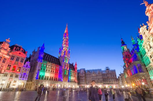 Brussels, Belgium - May 13, 2015: Tourists visiting famous Grand Place (Grote Markt) the central square of Brussels. The square is the most important tourist destination and most memorable landmark in Brussels. 