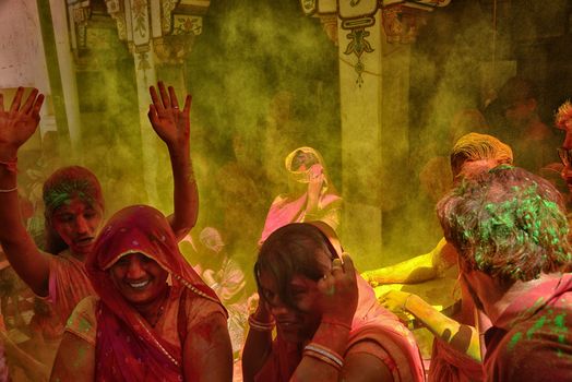 INDIA, Jodhpur: Indian people celebrate the Holi festival in Jodhpur on March 23, 2015. Holi, the Hindu spring festival or 'Festival of Colours' is celebrated with coloured powder and water and marks the end of winter and the beginning of spring. 