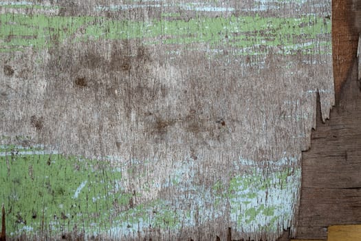 fragment of old dirty plywood, wooden background