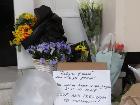 UNITED KINGDOM, London : Tributes to the victims of the terror attacks in Brussels are seen inside the Belgian Embassy in central London on March 23, 2016.Security was tightened across Europe and transport links paralysed after a series of apparently coordinated explosions ripped through Brussels airport and a metro train, killing at least 35 people.