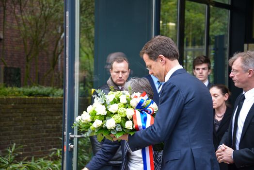 NETHERLANDS, The Hague: Dutch Prime Minister Mark Rutte lays a wreath at the Belgium Embassy on March 23, 2016, for the victims of the terror attacks in Brussels.Mourners laid flowers a day after bombings at a subway station and airport left 30 people dead and hundreds wounded in neighboring Belgium.  