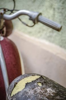 Retro Style Detail Of A Vintage Motorcycle With Ripped Saddle