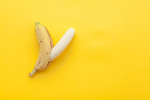 Peel banana and fruit on a yellow background and colorful background