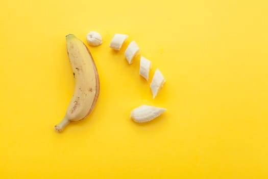 Peel banana and fruit on a yellow background and colorful background