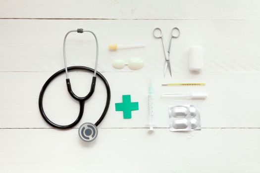 Portable and instrumental retro medical computer on white wooden background