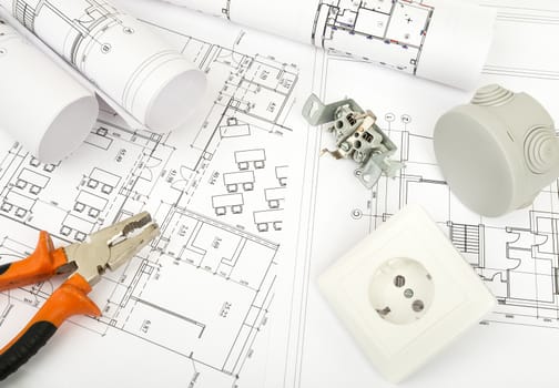 Architecture plan and rolls of blueprints with pliers and socket. Building concept