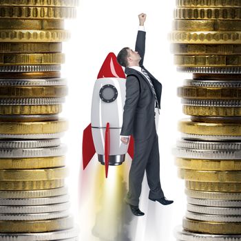 Businessman flying on rocket between two piles of coins