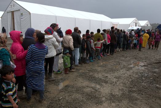 GREECE, Idomeni: Thousands of migrants are stranded in a makeshift camp for migrants and refugees at the Greek-Macedonian border near the village of Idomeni on March 23, 2016. The UN refugee agency harshly criticized an EU-Turkey deal on curbing the influx of migrants to Greece, saying reception centers had become detention facilities, and suspended some activities in the country. The EU and Ankara struck a deal aiming to cut off the sea crossing from Turkey to the Greek islands that enabled 850,000 people to pour into Europe last year, many of them fleeing the brutal war in Syria.